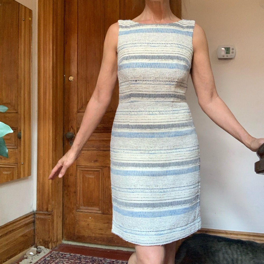Sleeveless Dress. Fully lined. Very nicely tailored. Sm walking slit in back.